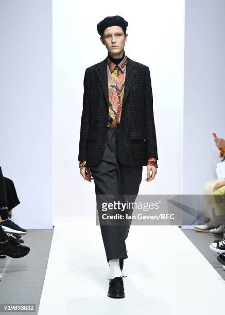 Model walks the runway at the Margaret Howell show during London Fashion Week February 2018 at Rambert on February 18, 2018 in London, England.