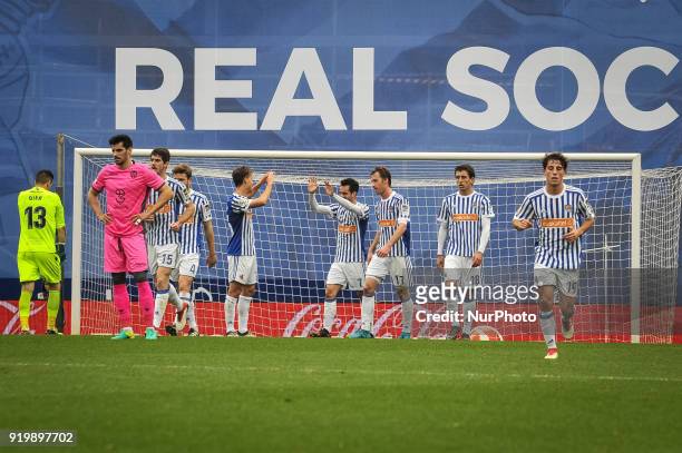 Juanmi of Real Sociedad celebrates with teammates after scoring during the Spanish league football match between Real Sociedad and Levante at the...