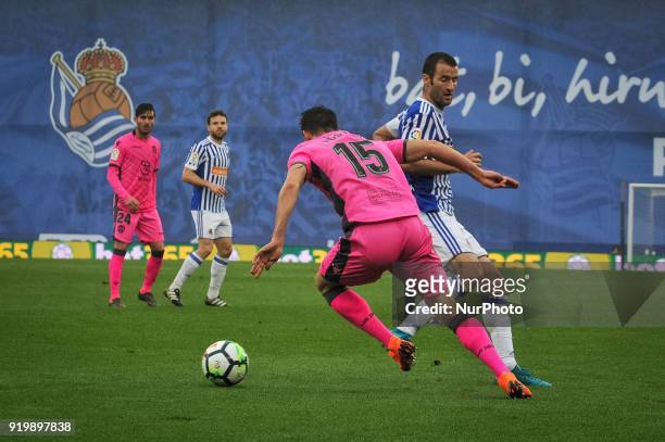 Postigo of Levante duels for the ball with Agirretxe of Real Sociedad during the Spanish league football match between Real Sociedad and Levante at...