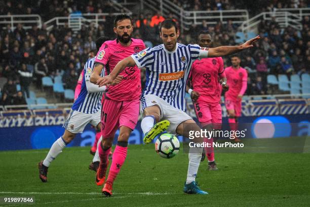 Agirretxe of Real Sociedad duels for the ball with Morales of Levante during the Spanish league football match between Real Sociedad and Levante at...