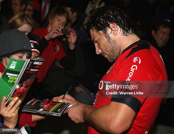 Byron Kelleher of Toulouse signs autographs after the Heineken Cup match between Harlequins and Toulouse at The Stoop on October 17, 2009 in...