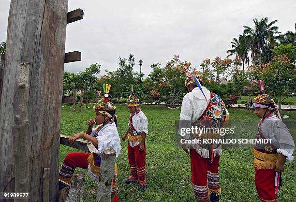 Mexican Totonaca native boy climbs a pole as he is tought the ritual dance of Los Voladores at a school for "Voladores" in Papantla, in the state of...