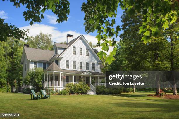 victorian home with lawn and large front porch in summer - front porch no people stock pictures, royalty-free photos & images