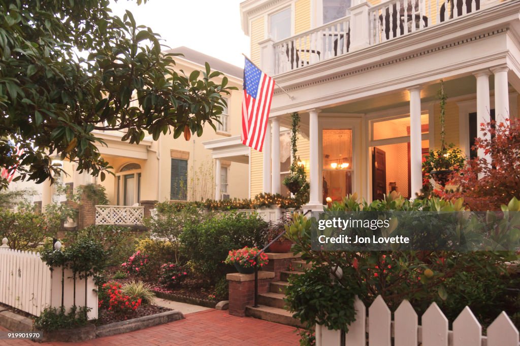 Front Porch and gardens with American Flag