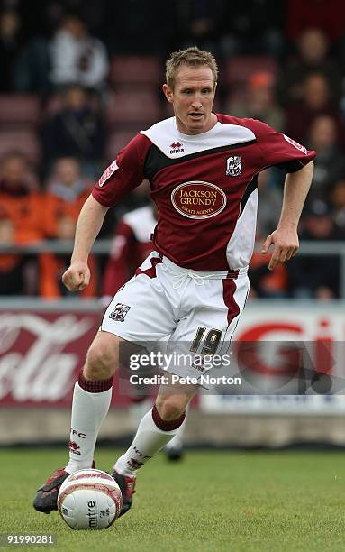 John Curtis of Northampton Town runs with the ball during the Coca Cola League Two match between Northampton Town and Lincoln City held on October...