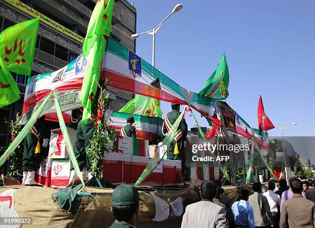 Iranian march during the funeral of Iran's elite Revolutionary Guards and local tribesmen in Zahedan near the Pakistani border on October 19, 2009....