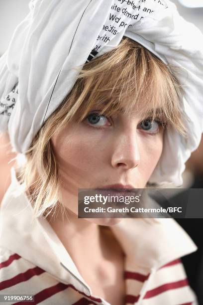 Edie Campbell backstage ahead of the Fashion East show during London Fashion Week February 2018 at TopShop Show Space on February 18, 2018 in London,...