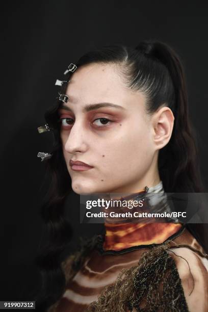 Model backstage ahead of the Fashion East show during London Fashion Week February 2018 at TopShop Show Space on February 18, 2018 in London, England.