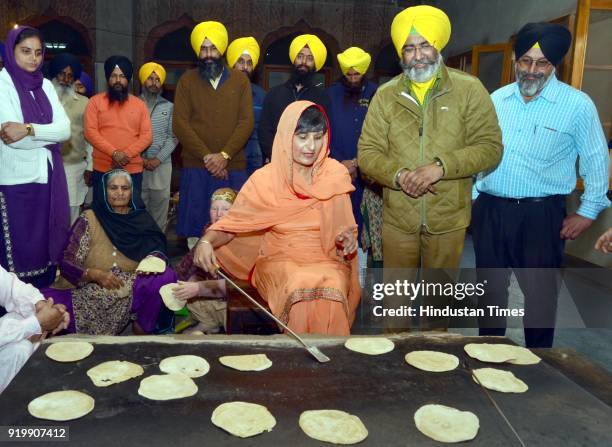 Australian High Commissioner Harinder Sidhu prepares Chapatis in the kitchen during paying obeisance at Golden Temple, on February 17, 2018 in...