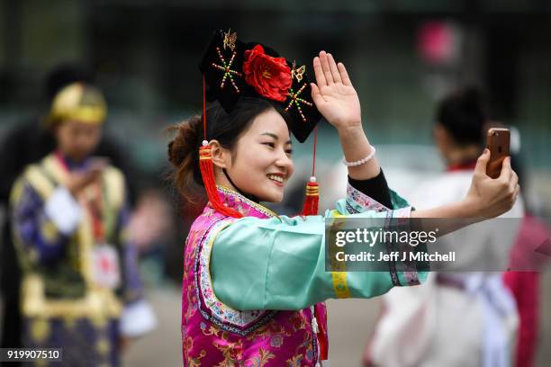 Woman takes a selfie as the Chinese community in Glasgow celebrate during Lunar New Year celebrations for the Year of the Dog at George Square on...