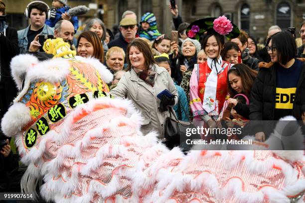 The Chinese community in Glasgow celebrate during Lunar New Year celebrations for the Year of the Dog at George Square on February 18, 2018 in...