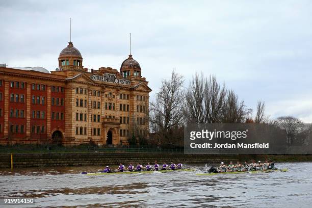 Both boats pass the Harrods Furniture Depository during the Boat Race Trial race between Cambridge University Boat Club and University of London on...