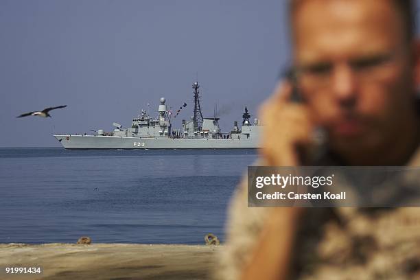 German soldier is on the phone in front of the frigate Karlsruhe in the Port of Djibouti on December 15, 2008 in Djibouti. The warship F212 of the...