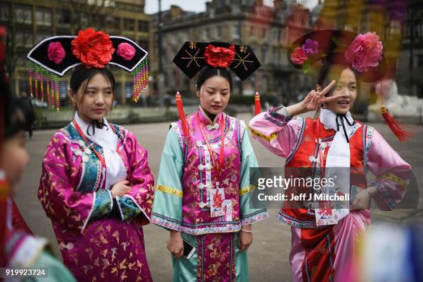 Women dressed in traditional clothing stand as the Chinese community in Glasgow celebrate during Lunar New Year celebrations for the Year of the Dog...