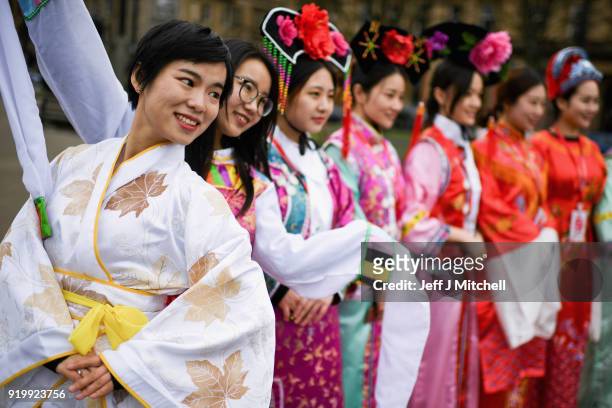 Women dressed in traditional clothing stand as the Chinese community in Glasgow celebrate during Lunar New Year celebrations for the Year of the Dog...