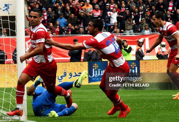 Tunisia's Club Africain player Wissem Ben Yahia celebrates with his teammates after scoring a goal during the Tunisia Ligue 1 football match derby...