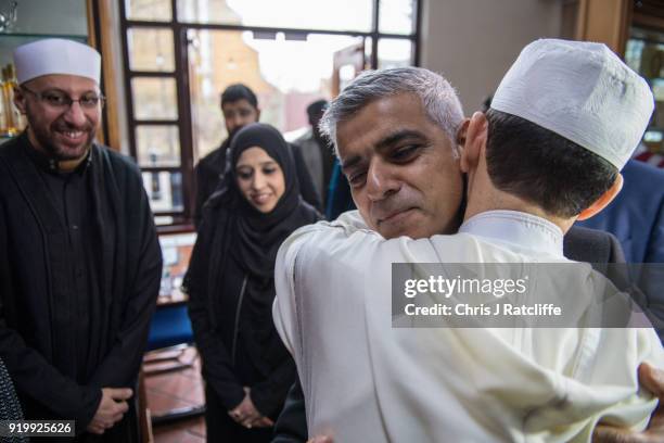 Mayor of London, Sadiq Khan, embraces a Muslim cultural leader during a visit to Al Manaar mosque on Visit My Mosque Day on February 18, 2018 in...