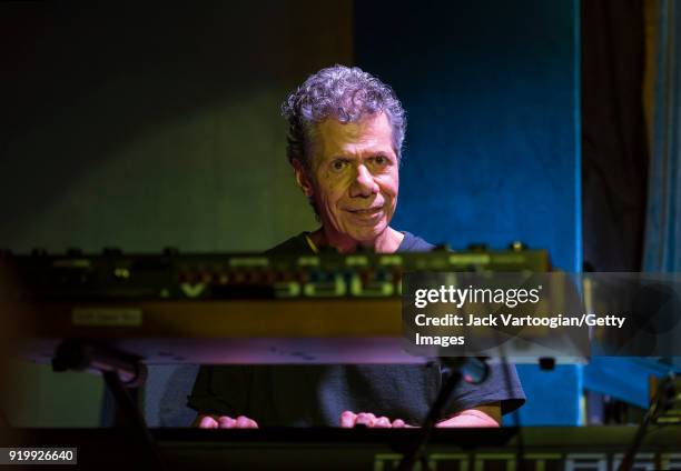 American Jazz musician Chick Corea plays piano as he leads the Corea/Gadd Band during the late set at the Blue Note nightclub, New York, New York,...