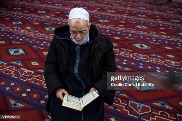Muslim man reads the Quran in the prayer room at Al Manaar mosque on Visit My Mosque Day on February 18, 2018 in London, England. Visit My Mosque Day...