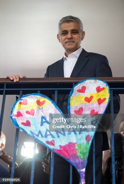 Mayor of London, Sadiq Khan, poses for a photo next to a paper heart that was amongst many created after the Grenfell tower tragedy, during a visit...