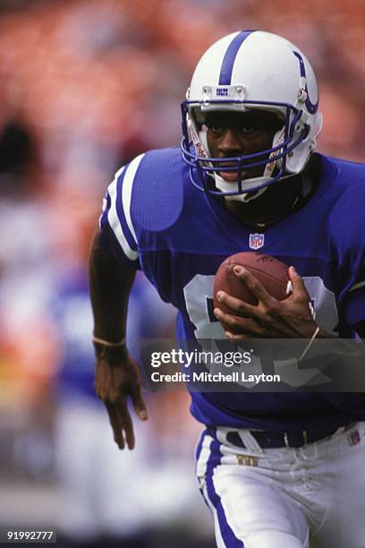 Marvin Harrison of the Indianapolis Colts runs with the ball during a NFL football game against the Washington Redskins on October 27, 1996 at RFK...