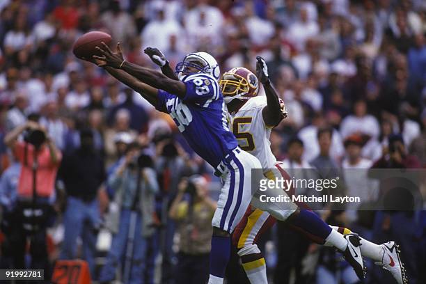 Marvin Harrison of the Indianapolis Colts makes a catch during a NFL football game against the Washington Redskins on October 27, 1996 at RFK Stadium...