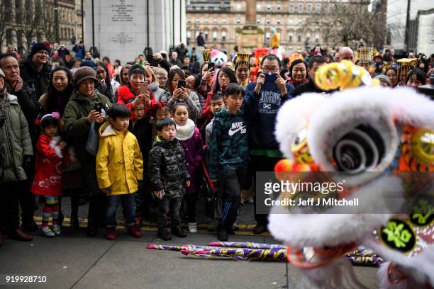 The Chinese community in Glasgow celebrate during Lunar New Year celebrations for the Year of the Dog at George Square on February 18, 2018 in...