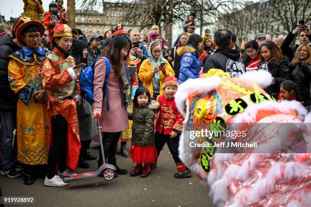 The Chinese community in Glasgow celebrate during Lunar New Year celebrations for the Year of the Dog at George Square on February 18, 2018 in...