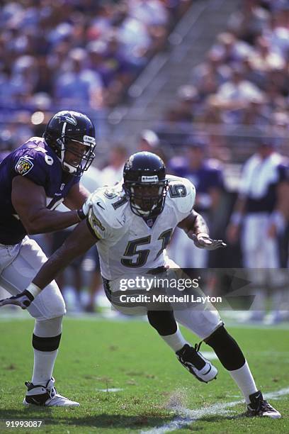 Kevin Hardy of the Jacksonville Jaguars gets by a block during a NFL football game against the Pittsburgh Steelers on September 10, 2000 at PSINet...