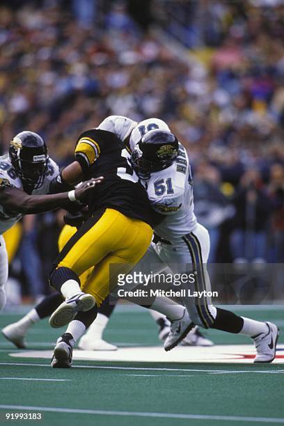 Kevin Hardy of the Jacksonville Jaguars makes a tackle during a NFL football game against the Pittsburgh Steelers on November 17, 1996 at Three...