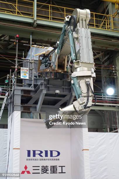 Photo taken Feb. 7, 2018 in Kobe, Japan, shows a large robot arm produced by Mitsubishi Heavy Industries Ltd. And the International Research...