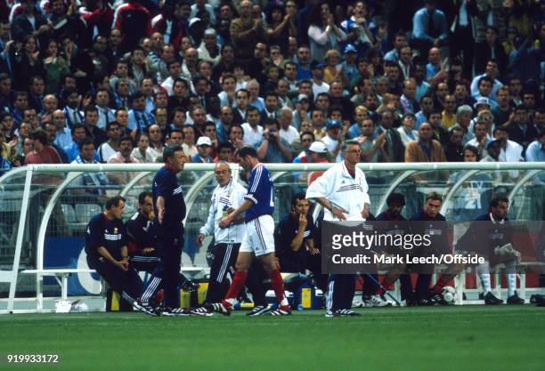 June 1998 - World Cup 1998 Football - France v Saudi Arabia - Zinedine Zidane of France walks past coach Aime Jacquet after he had been shown the red...