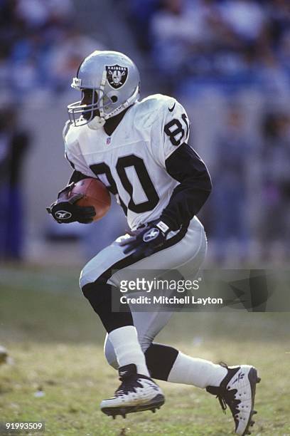 Desmond Howard of the Oakland Raiders runs with the ball during a NFL football game against the Carolina Panthers on November 2, 1997 at Ericsson...