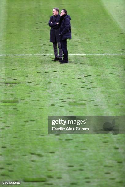 Hans-Joachim Watzke and Sport Director Michael Zorc of Dortmund inspect the pitch prior to the Bundesliga match between Borussia Moenchengladbach and...