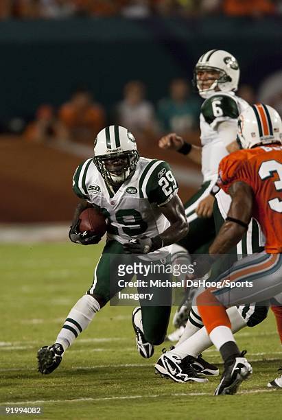 Leon Washington of the New York Jets carries the ball during an NFL game against the Miami Dolphins at Land Shark Stadium on October 12, 2009 in...