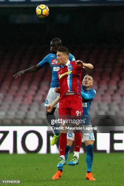 Kalidou Koulibaly of Napoli competes for the ball in air with Bartosz Salamon of Spal during the serie A match between SSC Napoli and Spal at Stadio...