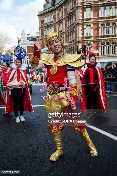 Woman dressed with traditional Chinese costume seen on the Chinatown streets during the Chinese New Year celebration. Chinese London community...
