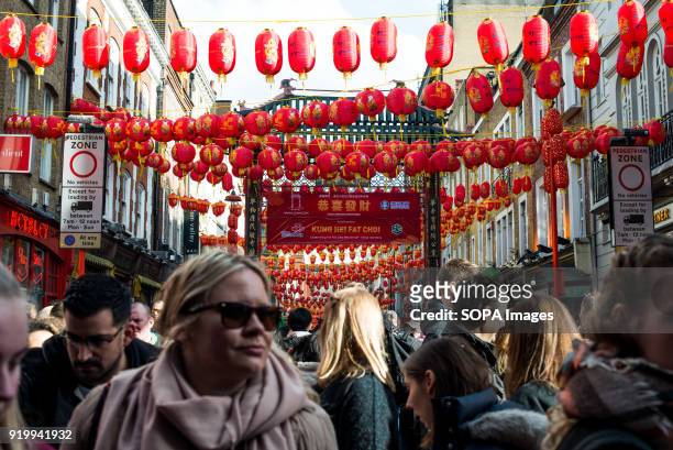 People seen walking through the Chinatown streets during the Chinese New Year celebration. Chinese London community celebrate the Year of the Dog,...