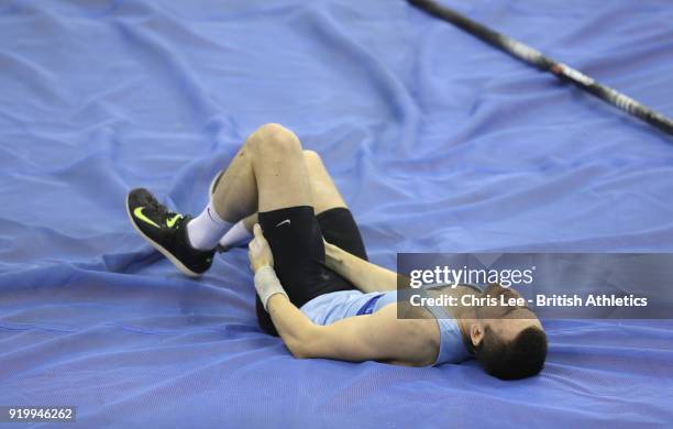 Charlie Myers holds his thigh in pain before he withdraws with an injury in the Mens Pole Vault during Day Two of the SPAR British Athletics Indoor...