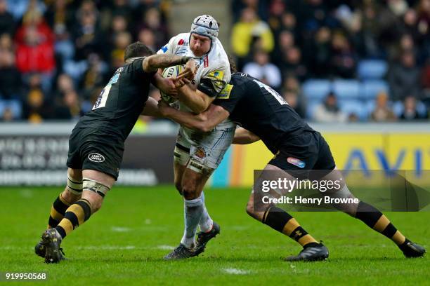 Thomas Waldrom of Exeter Chiefs tackled by Guy Thompson and Will Rowlands of Wasps during the Aviva Premiership match between Wasps and Exeter Chiefs...