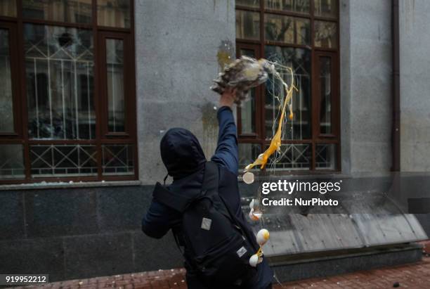 Protesters throw eggs and stouns in the windows of Rossotrudnichestvo office in Kyiv. Several dozens of supporters and members of the right-wing...