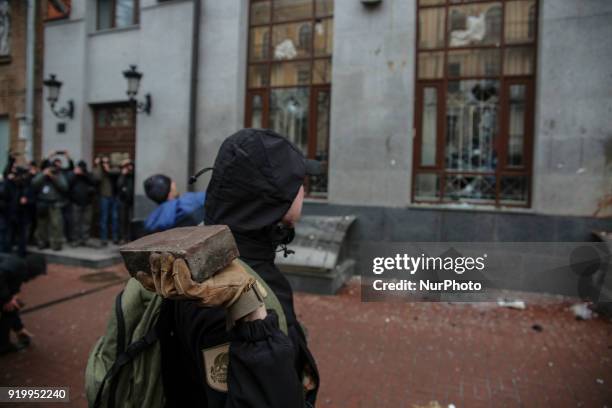 Protesters throw eggs and stouns in the windows of Rossotrudnichestvo office in Kyiv. Several dozens of supporters and members of the right-wing...