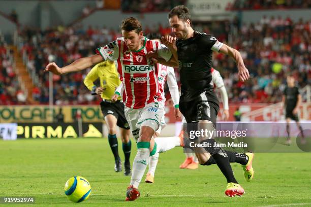 Igor Lichnovsky of Necaxa fights for the ball with Jose Basanta of Monterrey during the 8th round match between Necaxa and Monterrey as part of the...