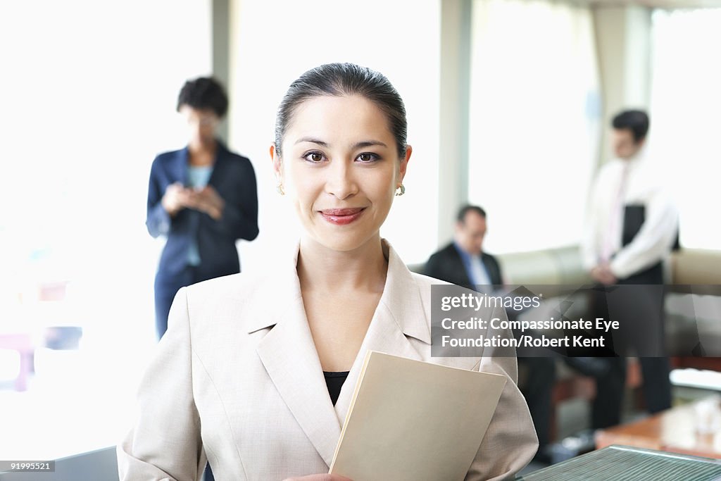 Portrait business woman holding document