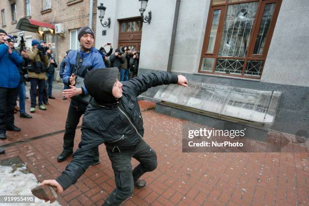 Right-wing activists threw stones and eggs at the window of the Russian Center of Science and Culture during their rally in Kiev, Ukraine, on...