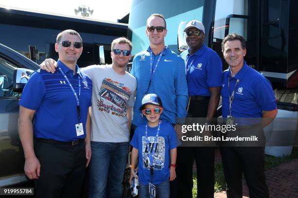 Two-time Super Bowl winning quarterback and honorary pace car driver, Peyton Manning and his son, Marshall, pose with former NASCAR driver Dale...