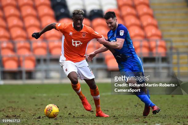 Blackpool's Armand Gnanduillet vies for possession with Peterborough United's Andrew Hughes during the Sky Bet League One match between Blackpool and...