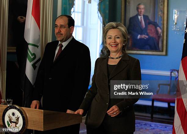 Secretary of State Hillary Clinton and Prime Minister of Iraq Nouri al-Maliki talk to reporters after a meeting at the State Department on October...