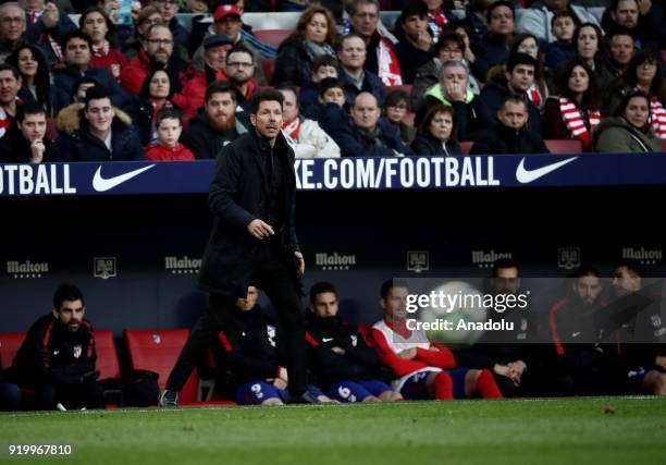 Head coach Diego Simeone of Atletico Madrid looks on from the substitutes' bench during a La Liga week 24 match between Atletico Madrid and Athletic...