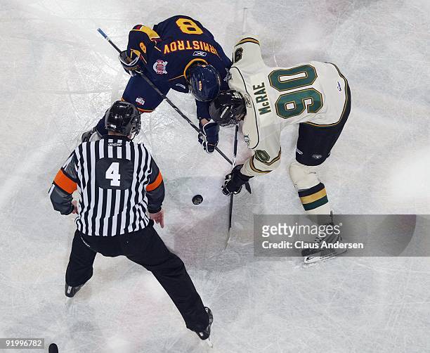 Alexander Burmistrov of the Barrie Colts takes a faceoff against Philip McRae of the London Knights in a game on October 16, 2009 at the John Labatt...